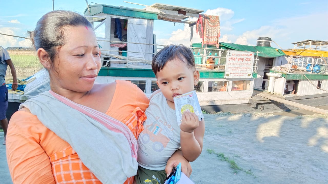 A child who has just received immunizations at the boat clinic. 