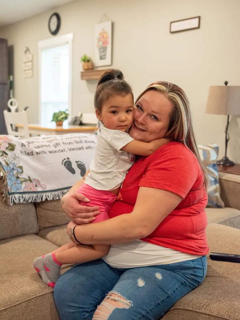 Amanda Lowery holds her daughter Aaliyah.