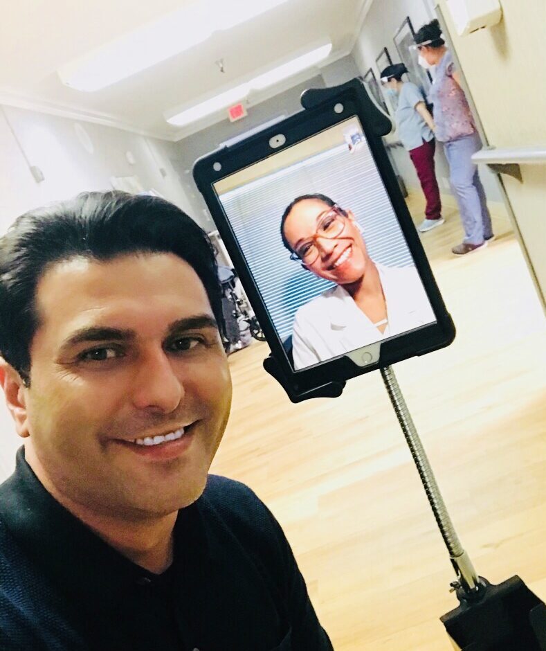 A telehealth medical assistant with a clinician, ready to set up a session.