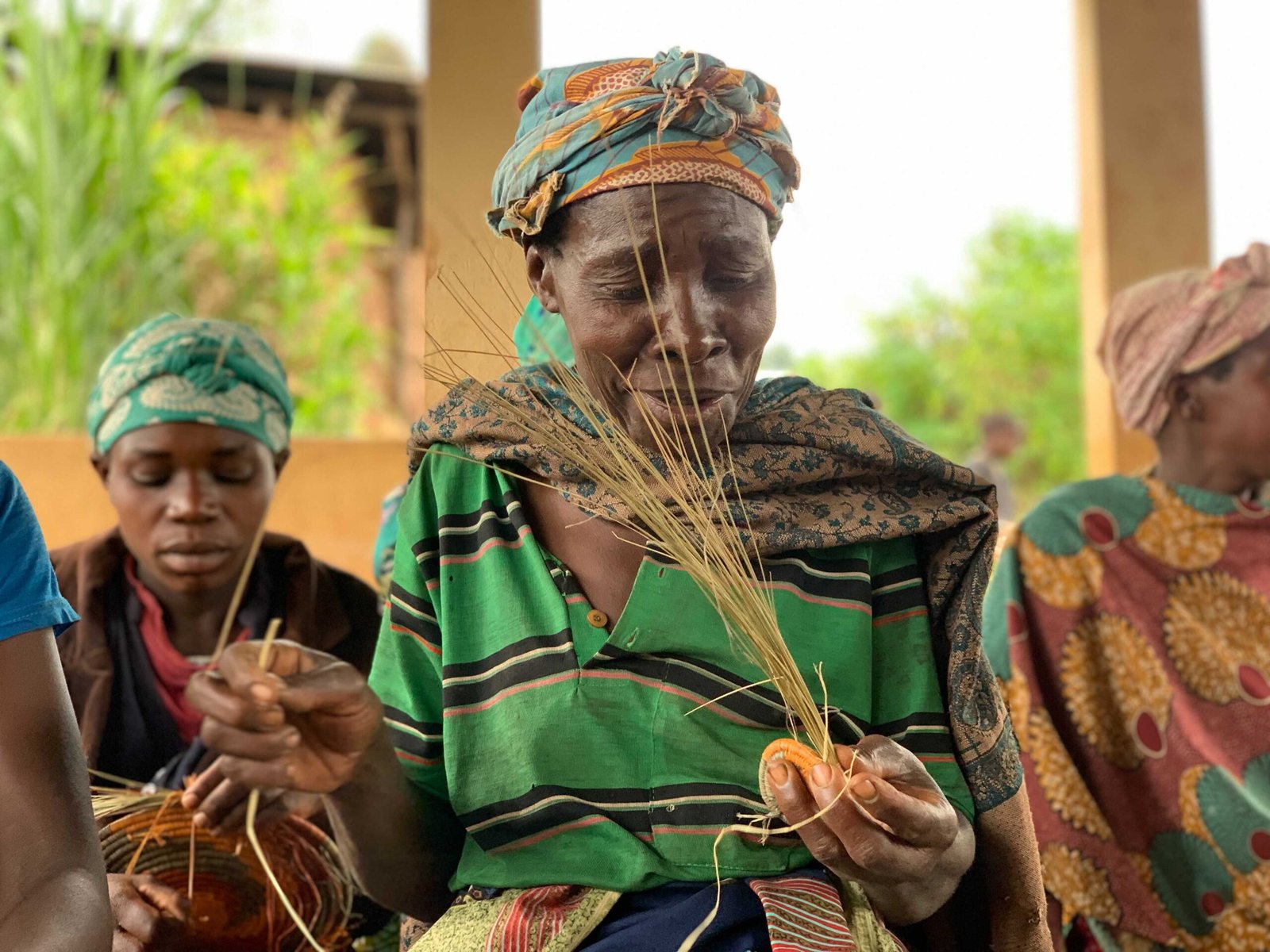 Livera, a Bwindi artist who does basket weaving.