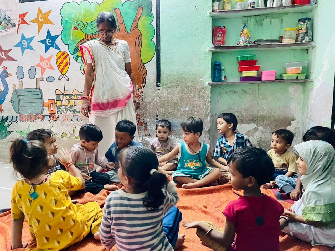 Children gather to play at a childcare center in India.