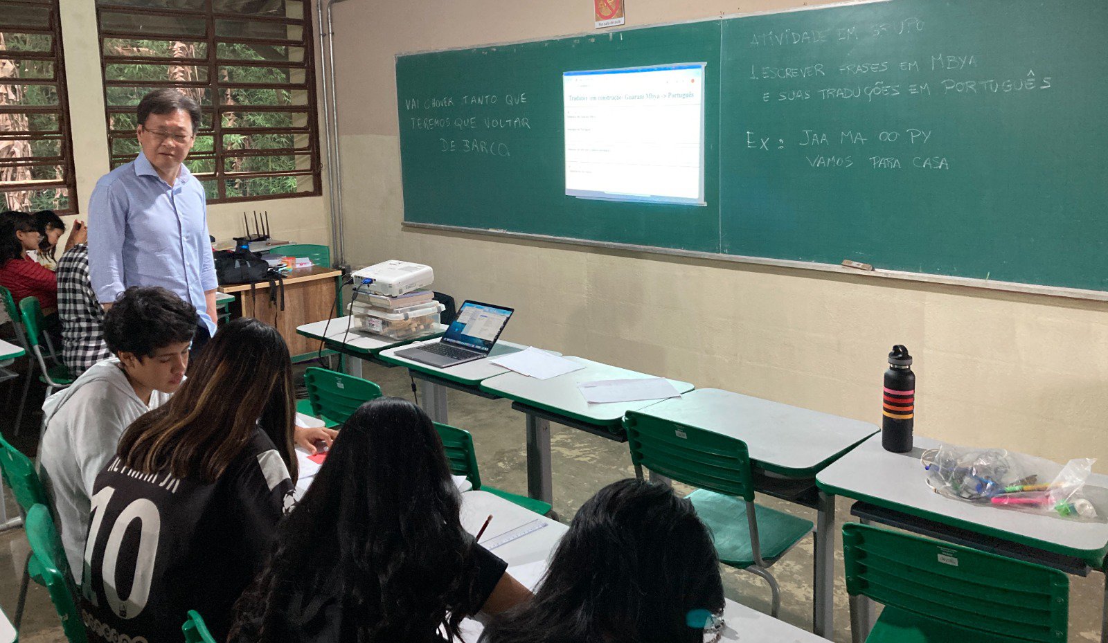 Students learn language skills in a classroom.