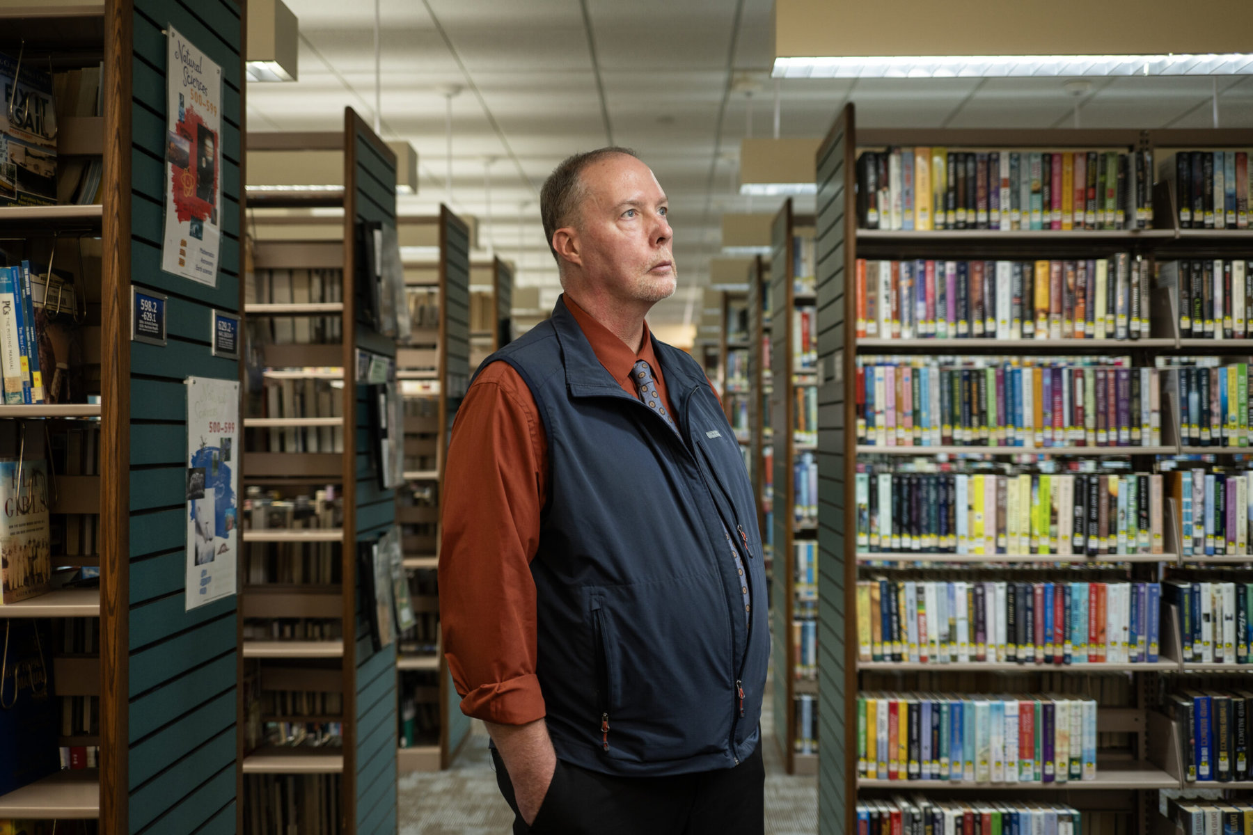 Matt Pfisterer, director of the Thrall Public Library District in Middletown, New York, stands in a library.