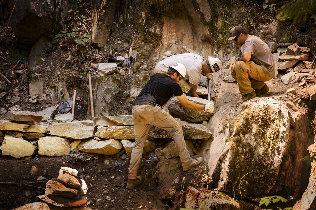 The Sierra Buttes Trail Stewardship Trail Crew building a solid trail foundation in steep terrain.