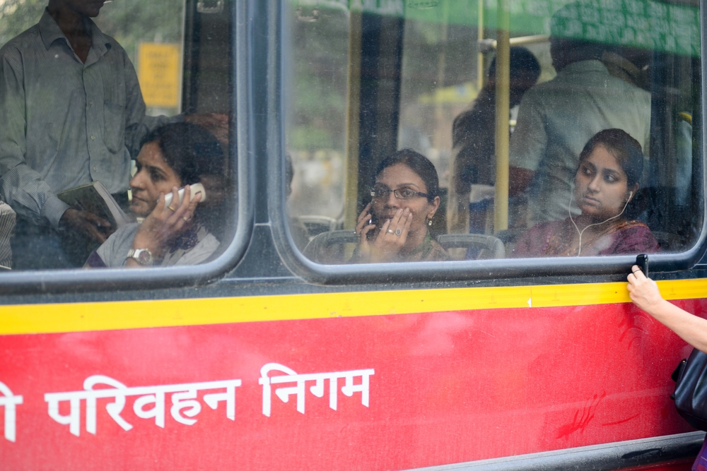 Women riding a bus in New Delhi. 