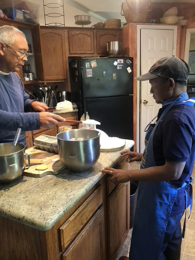 Tong Ginn (left) teaches Jesuda “Wee” Simla how to make croissants.