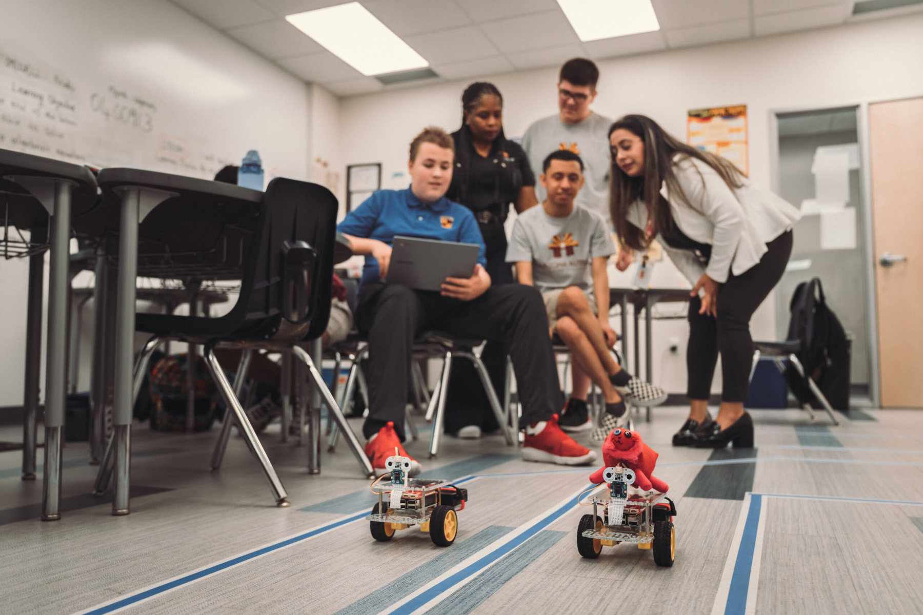 High school math teacher Supreet Kaur, AZACS’ STEAM and Innovation Director, leads students in coding and robotics using Go Pi Go. 