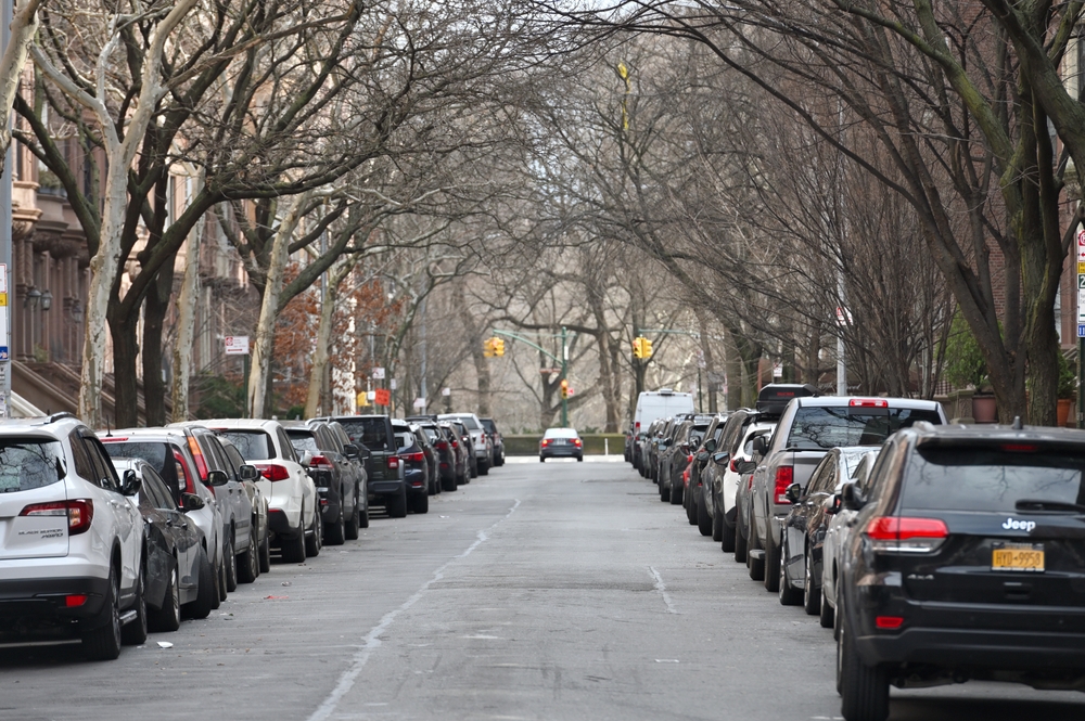 Cars parked on a street in New York City in winter.
