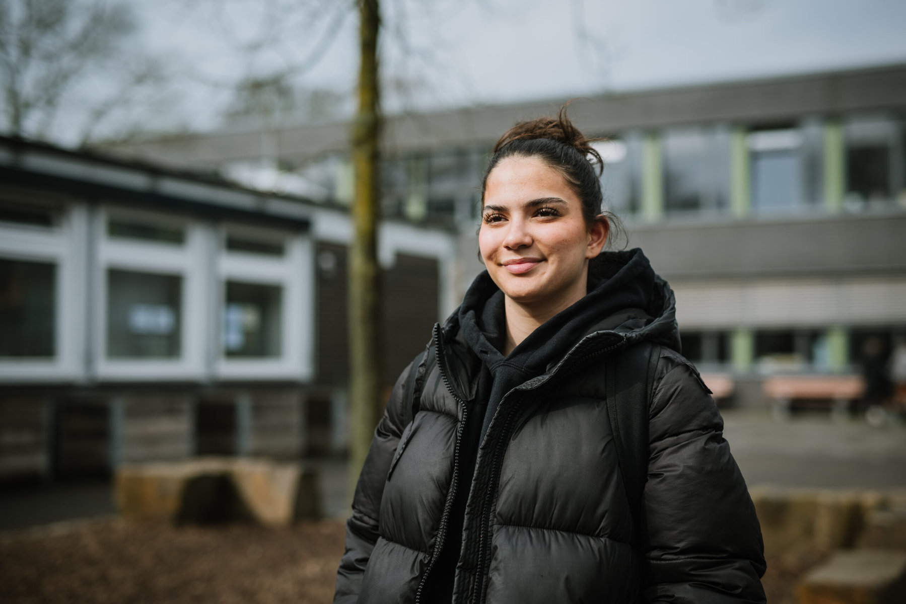 Portrait of Neriman Raim, 16-year-old student and school speaker in front of Ursula-Kuhr-Schule, a vocational school in Cologne Chorweiler, Germany on March 12th, 2024. The school has implemented the KAoA programme, "Kein Abschluss ohne Anschluss" ("No graduation without connection") which aims to support its students with finding a fitting follow up education or occupation already before finishing school.