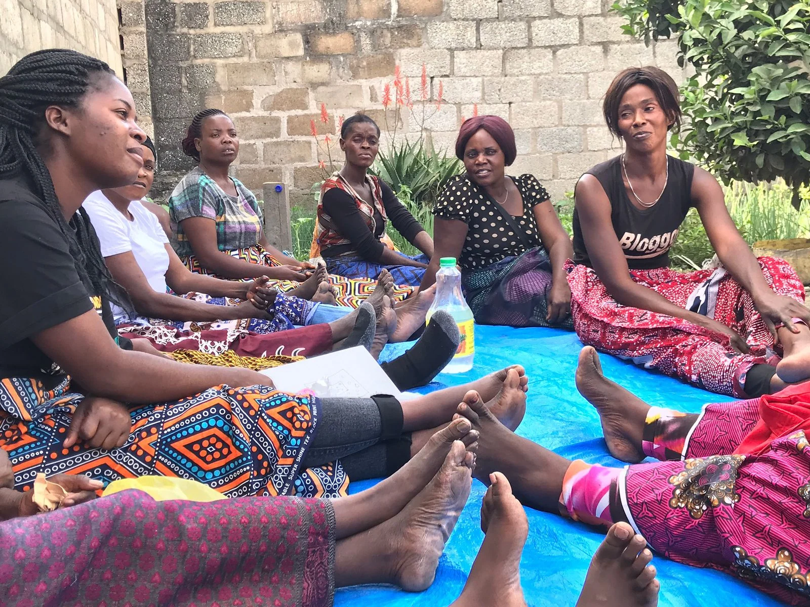 Women in Zambia gather for group therapy. 