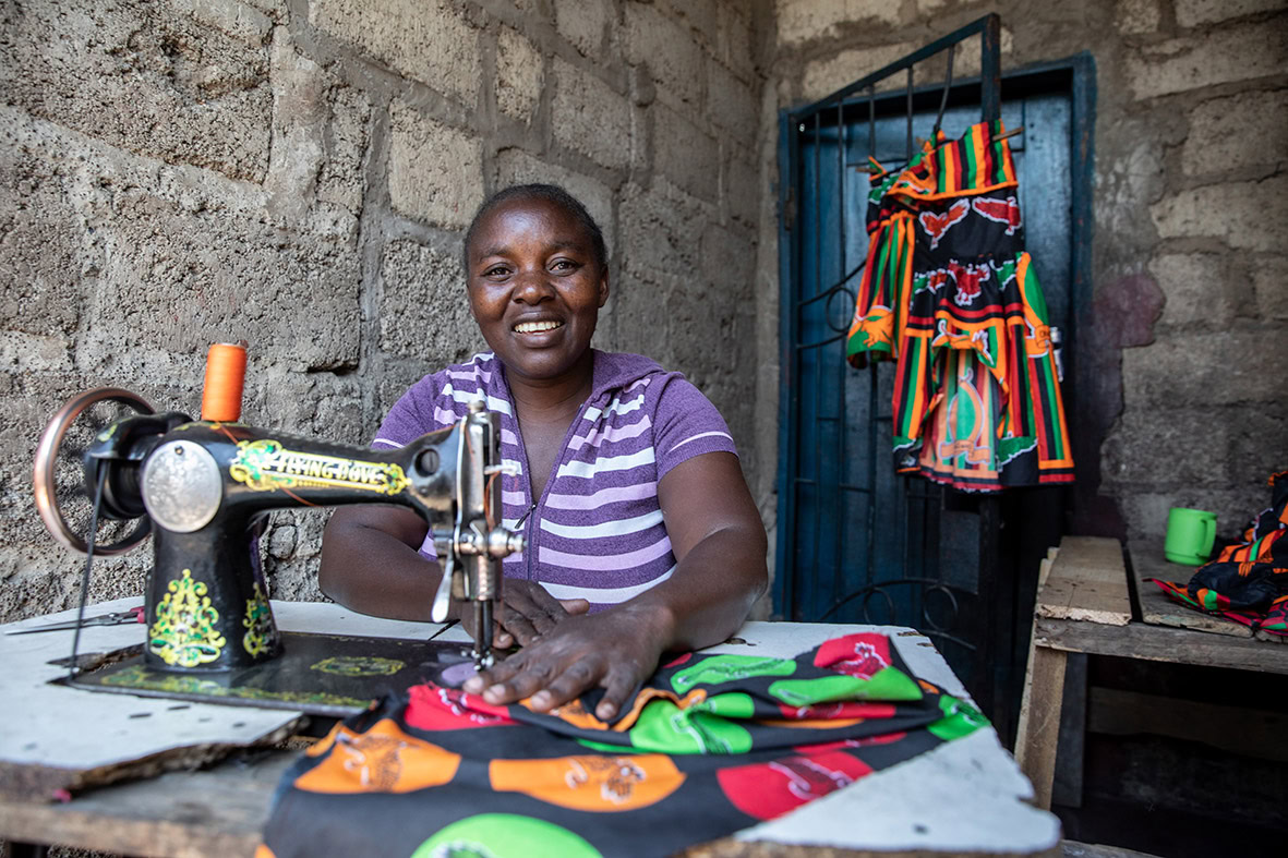 Clarity, a member of a StrongMinds group, runs her own small business as a tailor in Misisi Compound, Lusaka, Zambia. 