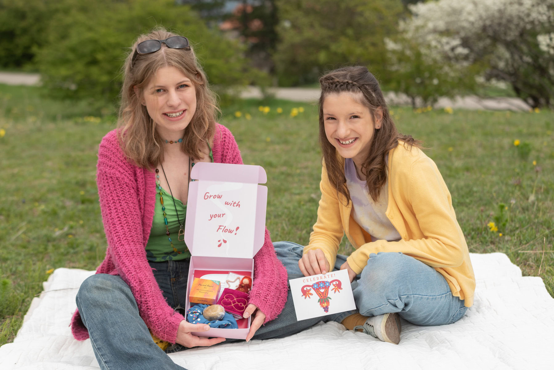 Burgsteiner and her daughter hold up period products.