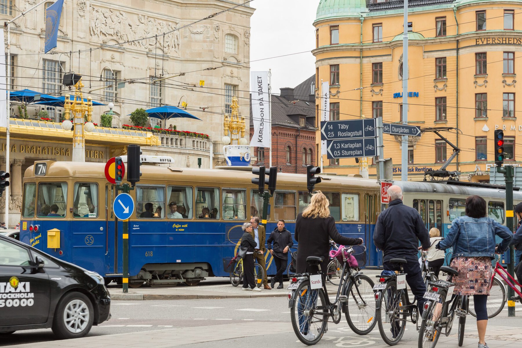 Cyclists and tram traffic in Stockholm's city center.