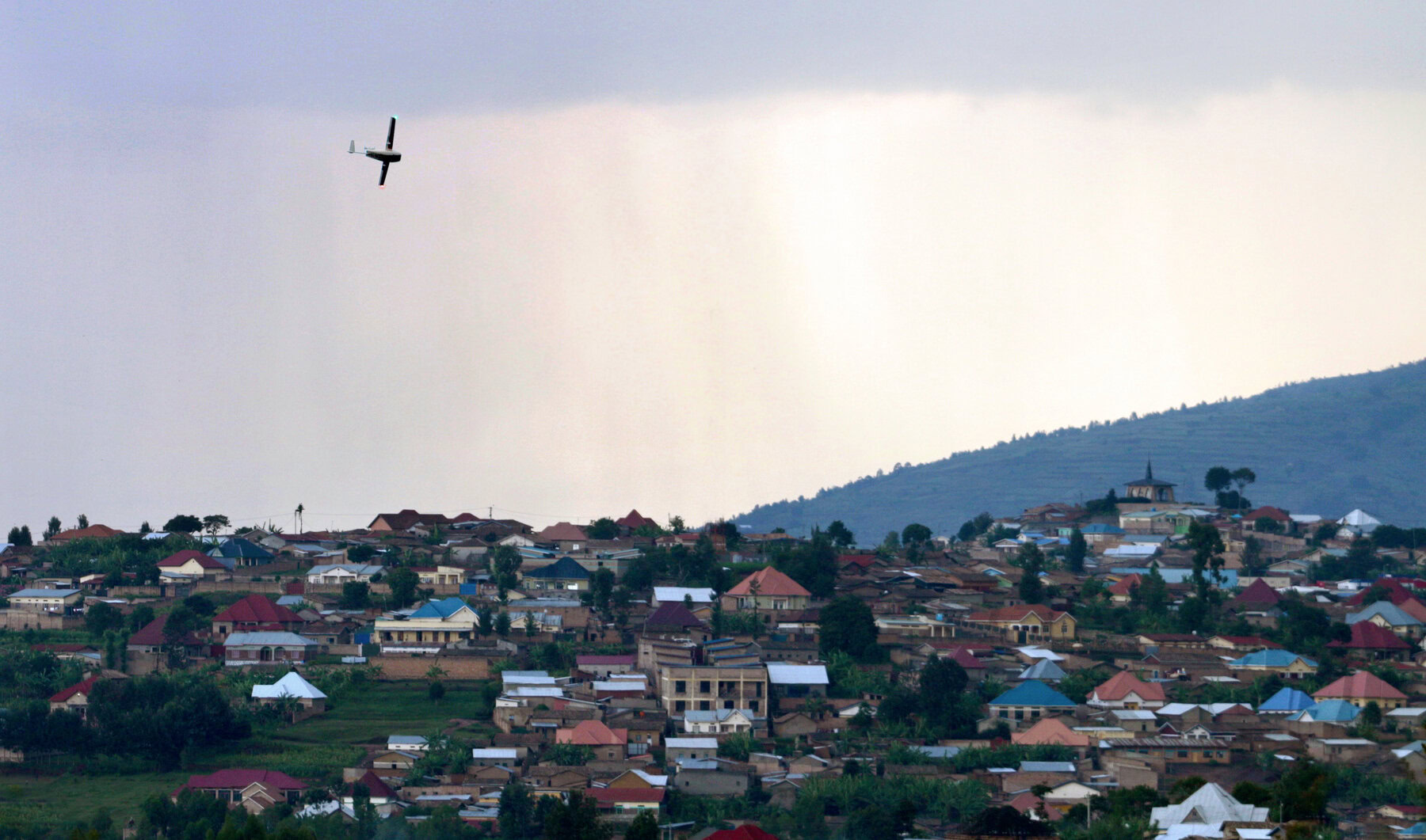 A Zipline drone flies over Muhanga, Rwanda.