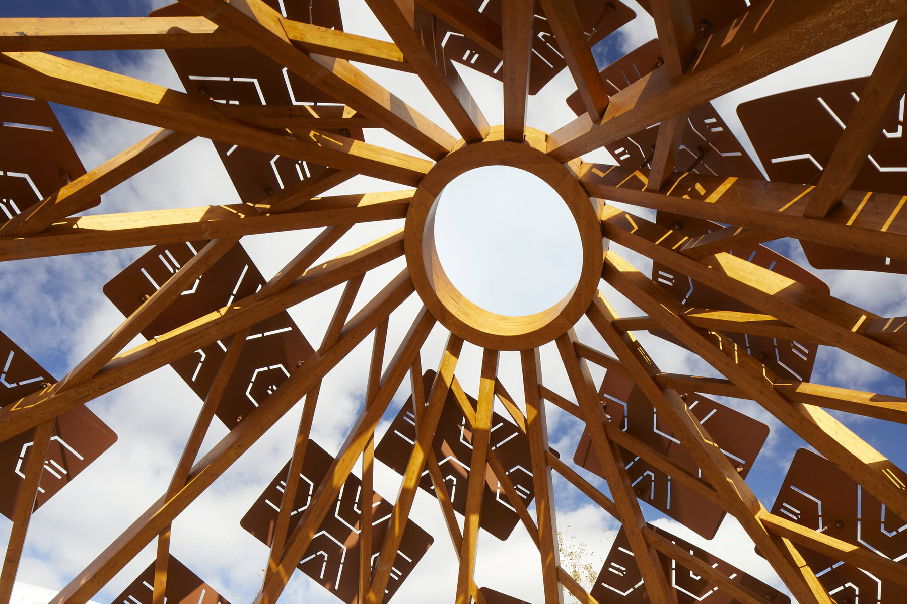 A view looking up at an Indigenous-inspired design at the Wampum Learning Lodge.