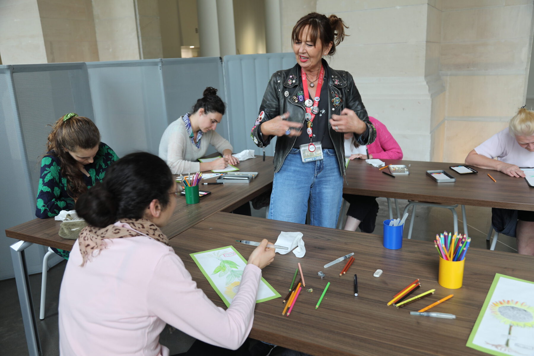 Pascaline Bonnave observing participants during an art therapy session.