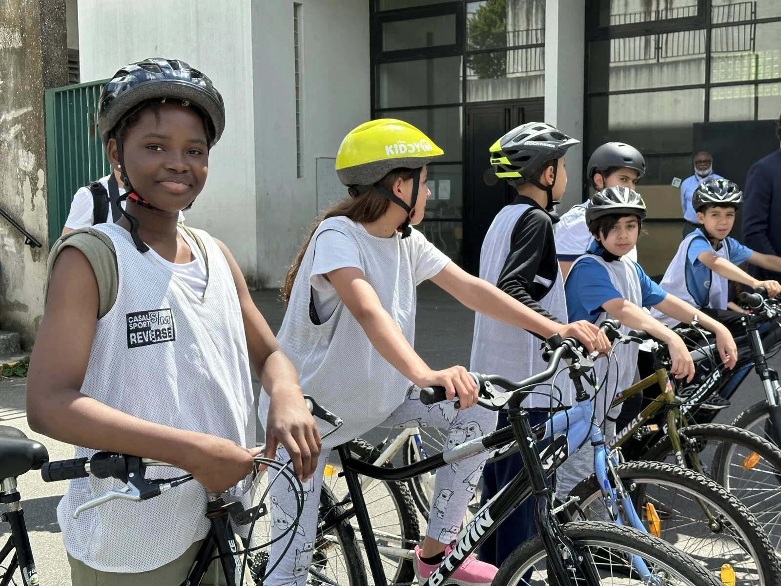 Students on their bikes wait to start riding.