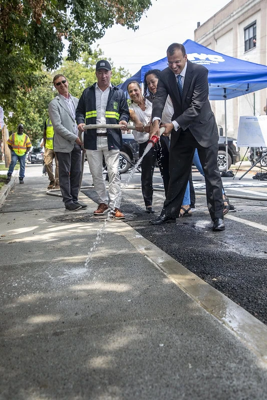 Rohit T. Aggarwala demonstrated the absorbing power of permeable pavement in Borough Park in July.