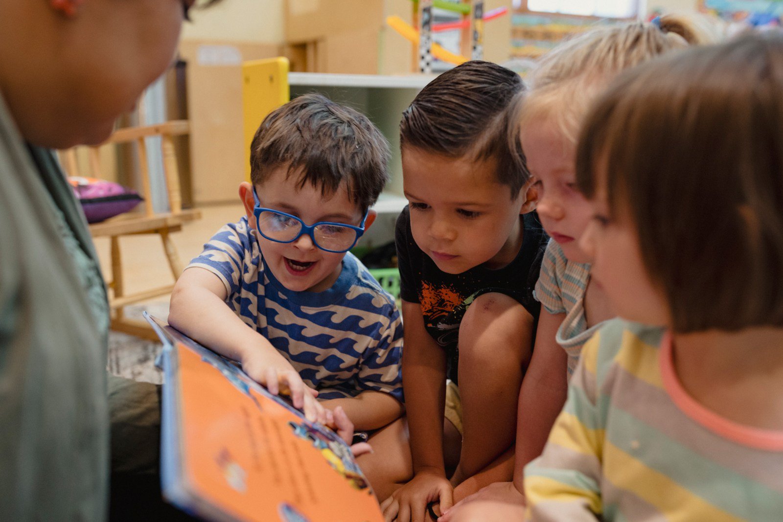 Niko Bailey, Kayden Monsey, Brooke Black and Aurelia De Maeseneer engage in a story time reading.