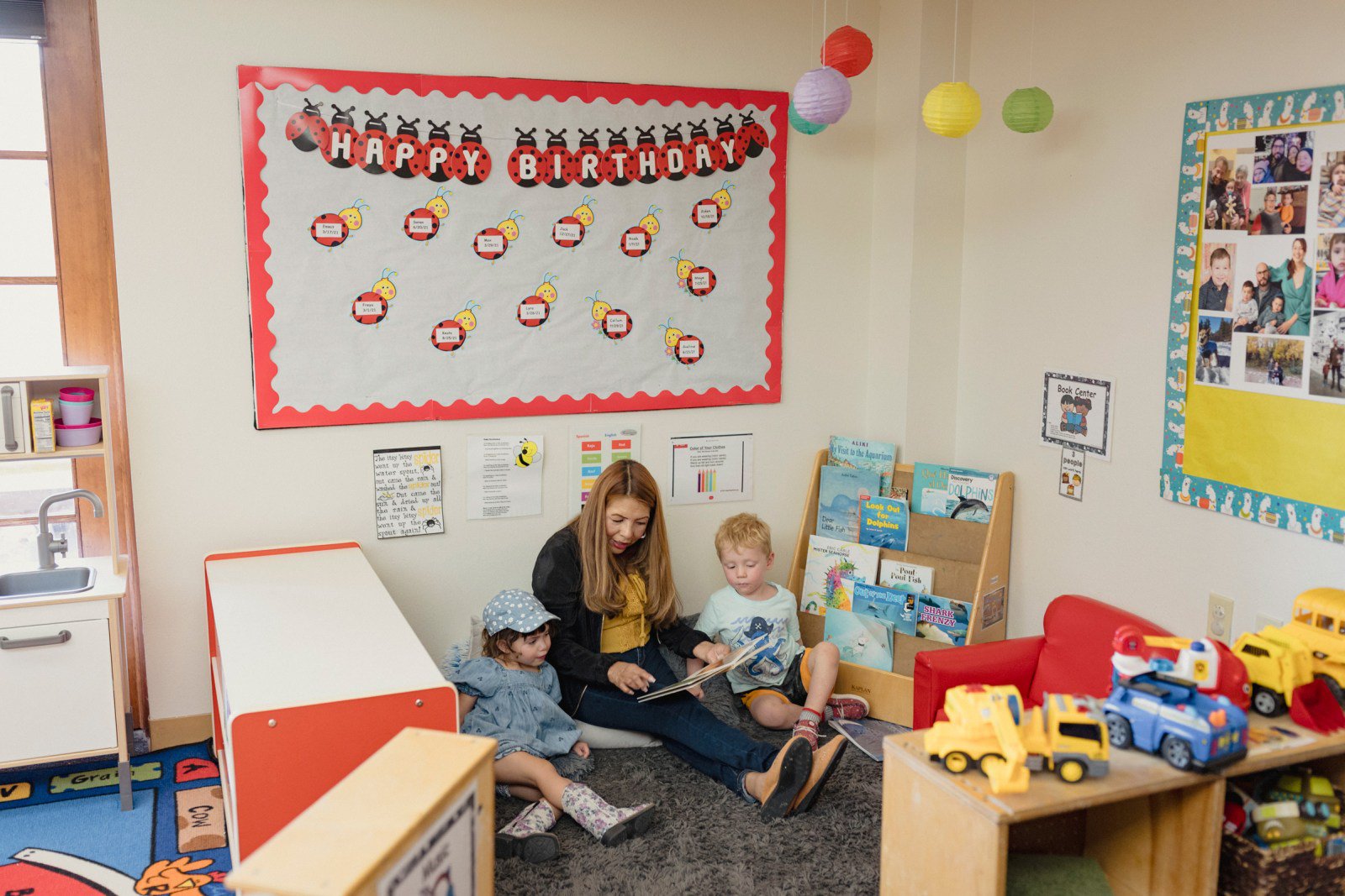 Barbara Cruz reads to Maya Garduno and Emmit Ruhl in a pre-K class at the First Presbyterian Church of Santa Fe’s Child Development Center in Santa Fe, New Mexico.