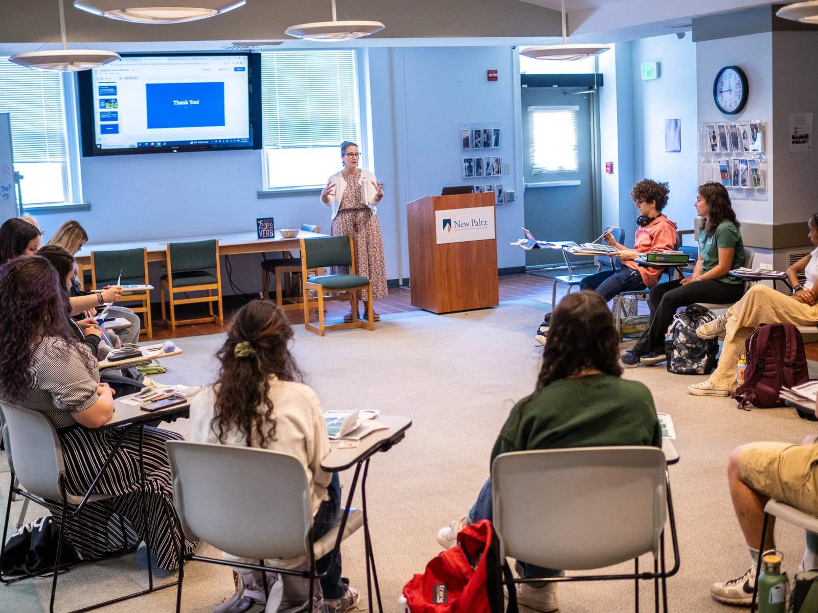 Associate Professor Andrea Varga speaks to the Ethical Fashion class after the final presentations.