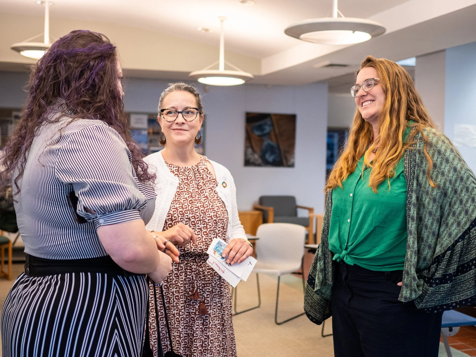 Andrea Varga talks with honors students at SUNY New Paltz after they’ve made presentations as part of her Ethical Fashion course.