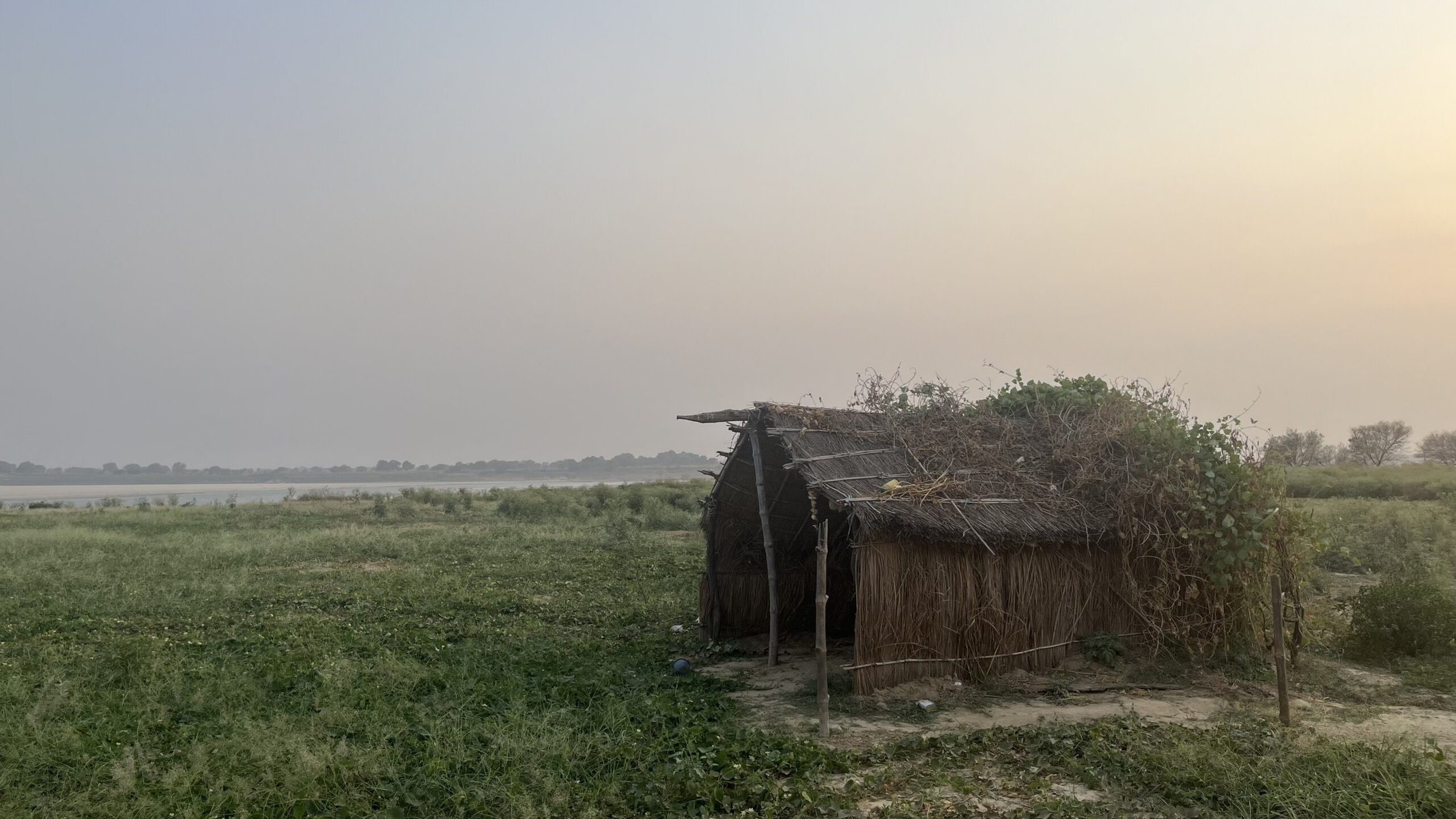 Floodplain farmers use temporary huts to shelter from the scorching summer sun.