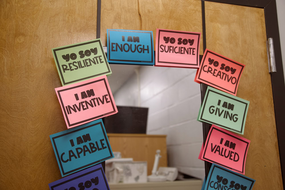 Inside the middle school counselors’ offices, affirmation signs surround a mirror to uplift kids’ self-image.