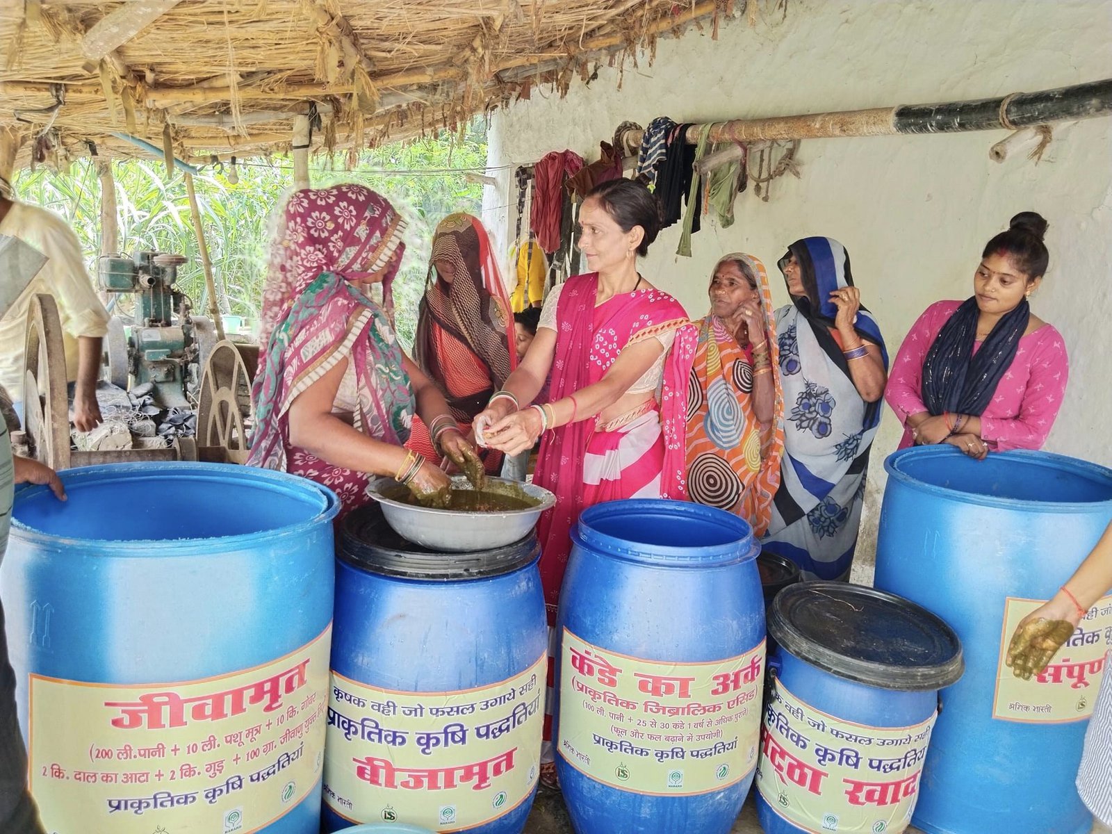 Women farmers making organic crop medicines.