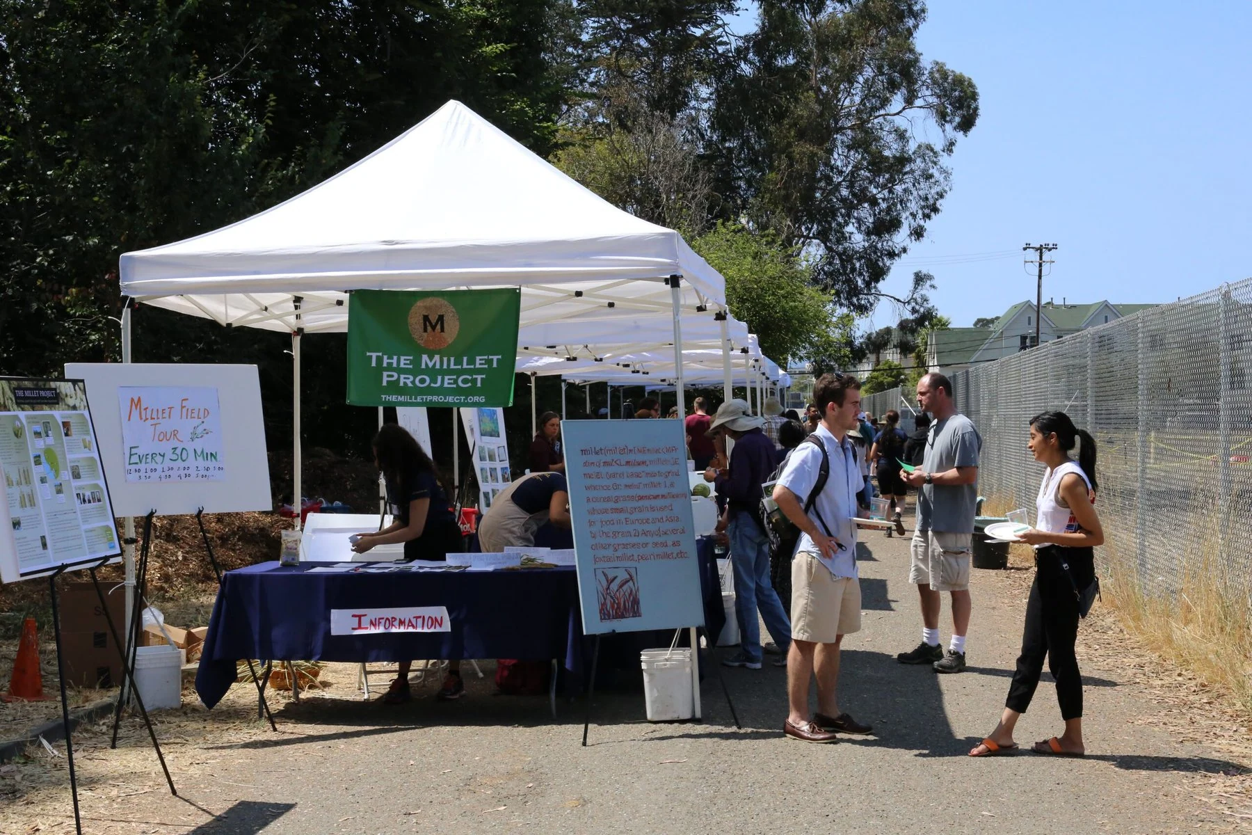 The Millet Project has tents set up to give out information.