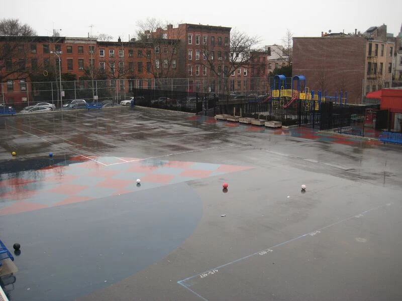 The schoolyard at New York's P.S. 261 before its transformation. 