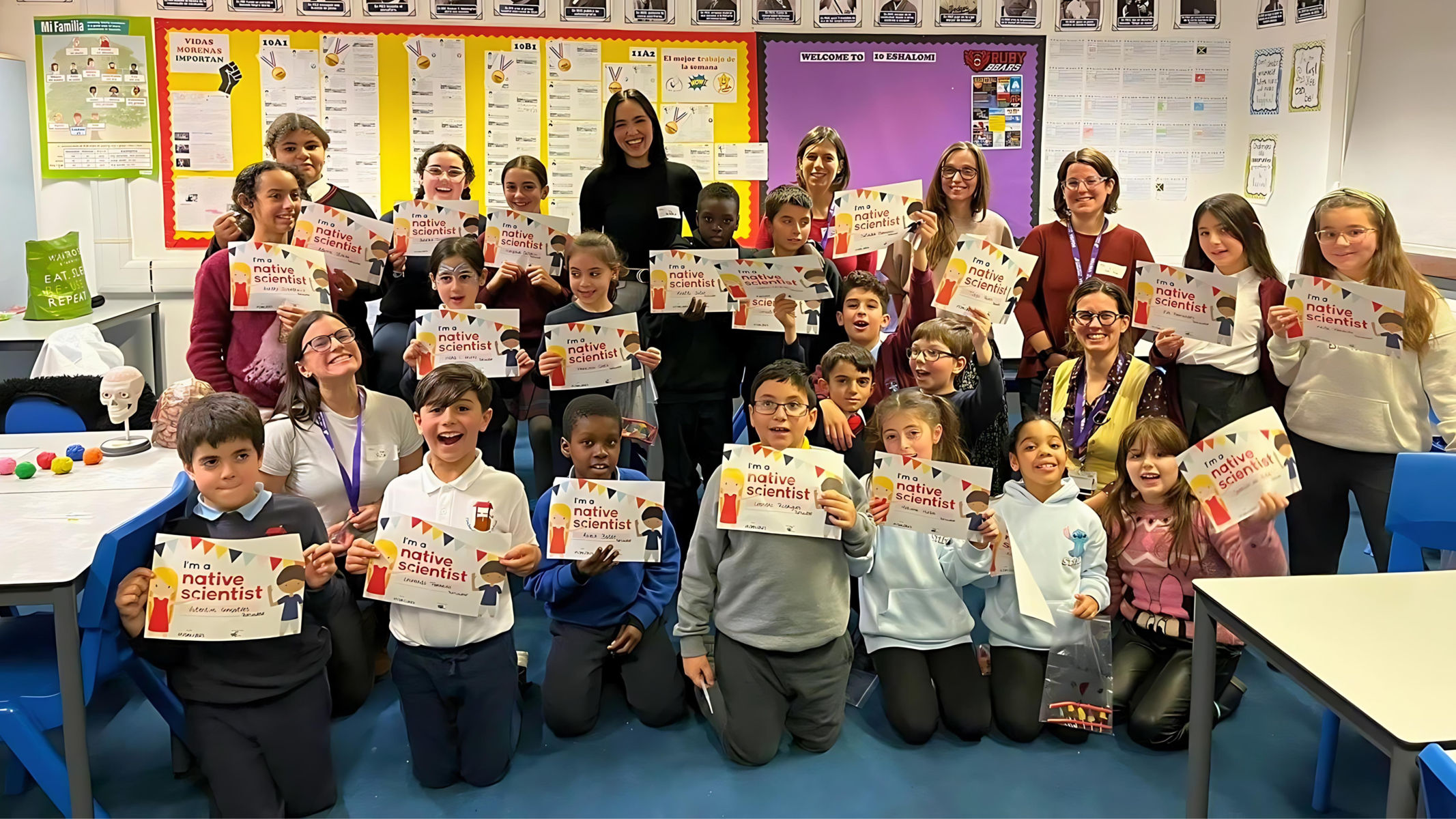 A group of students pose with Native Scientists certificates.