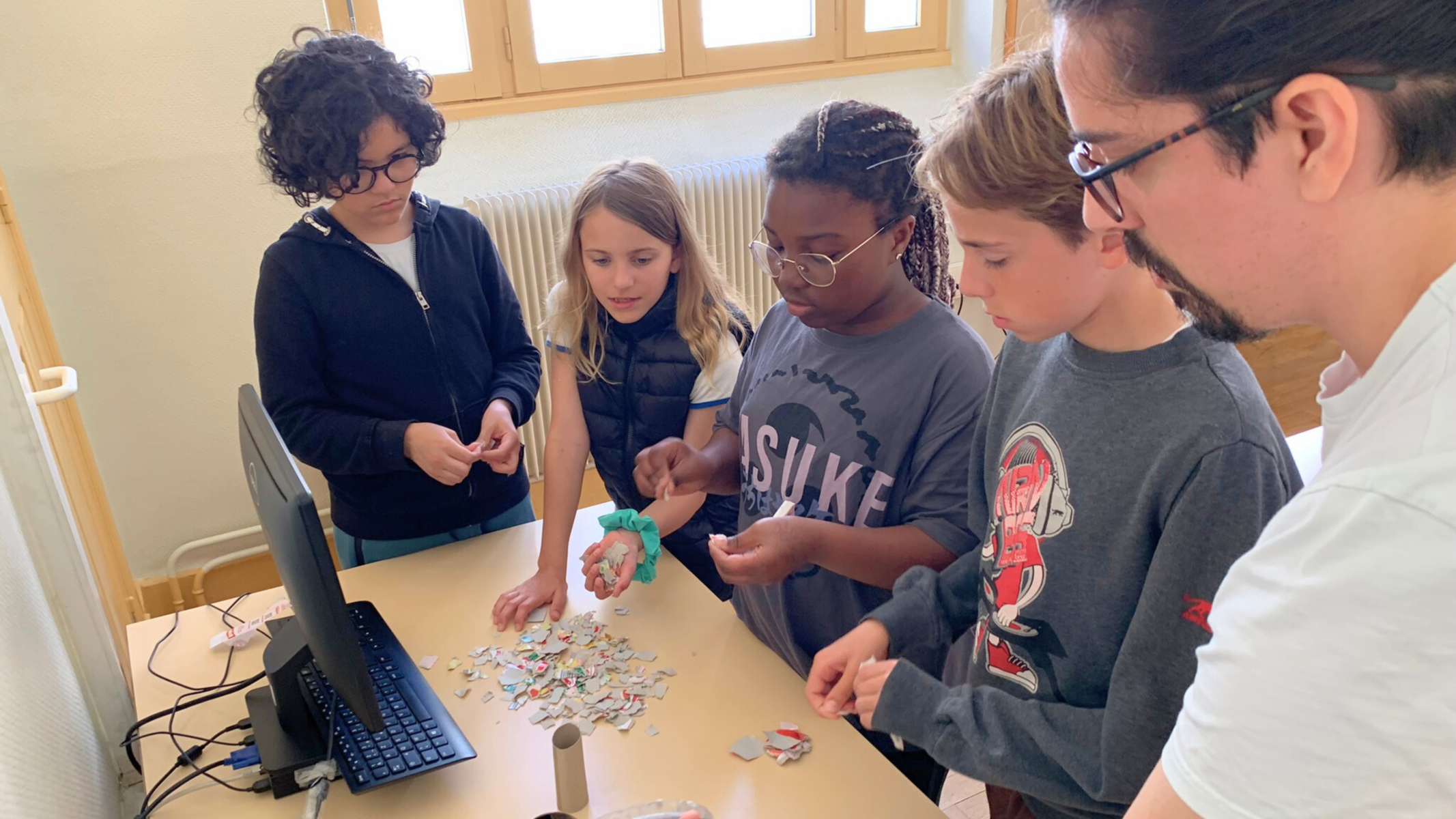 Children work together to solve a puzzle.