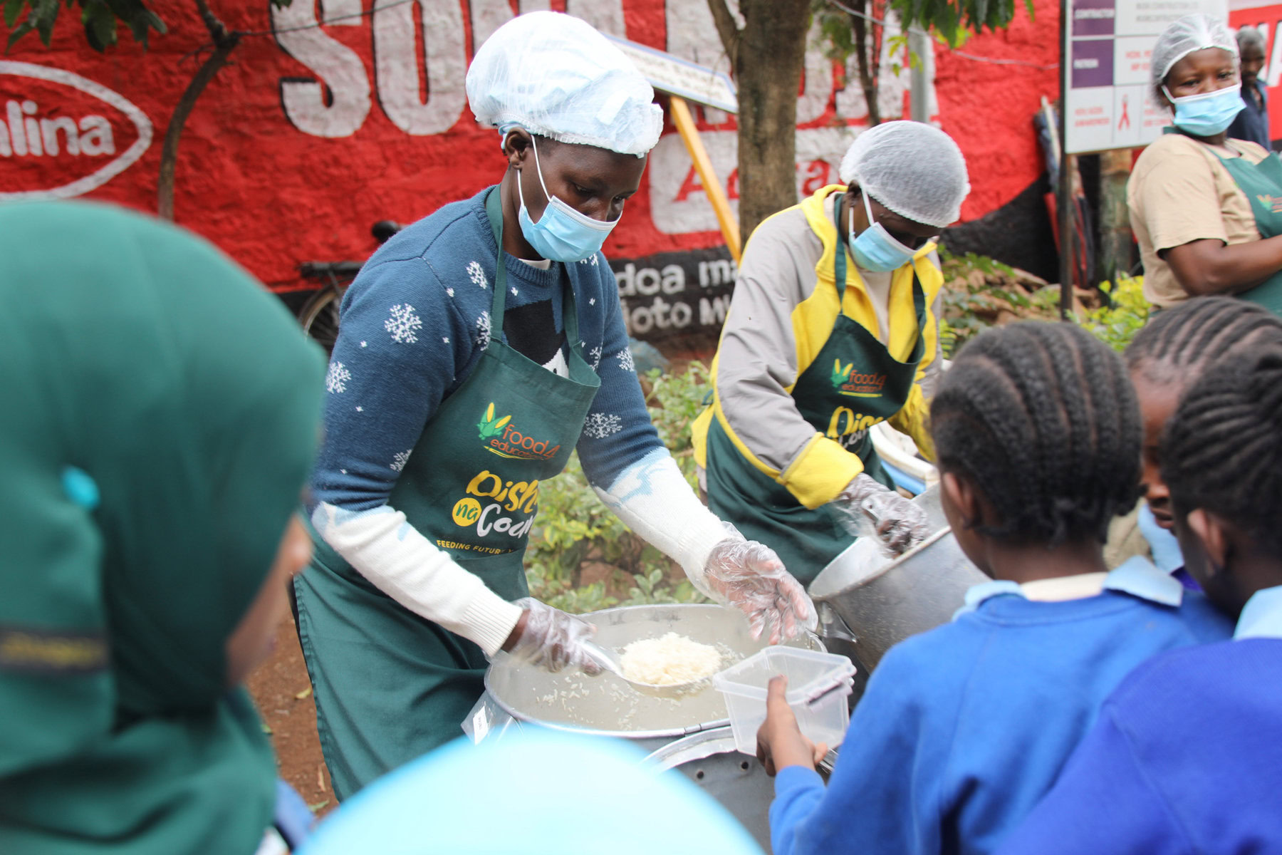 Kids being served at Olympic Primary School in the Kibera slum of Nairobi. 