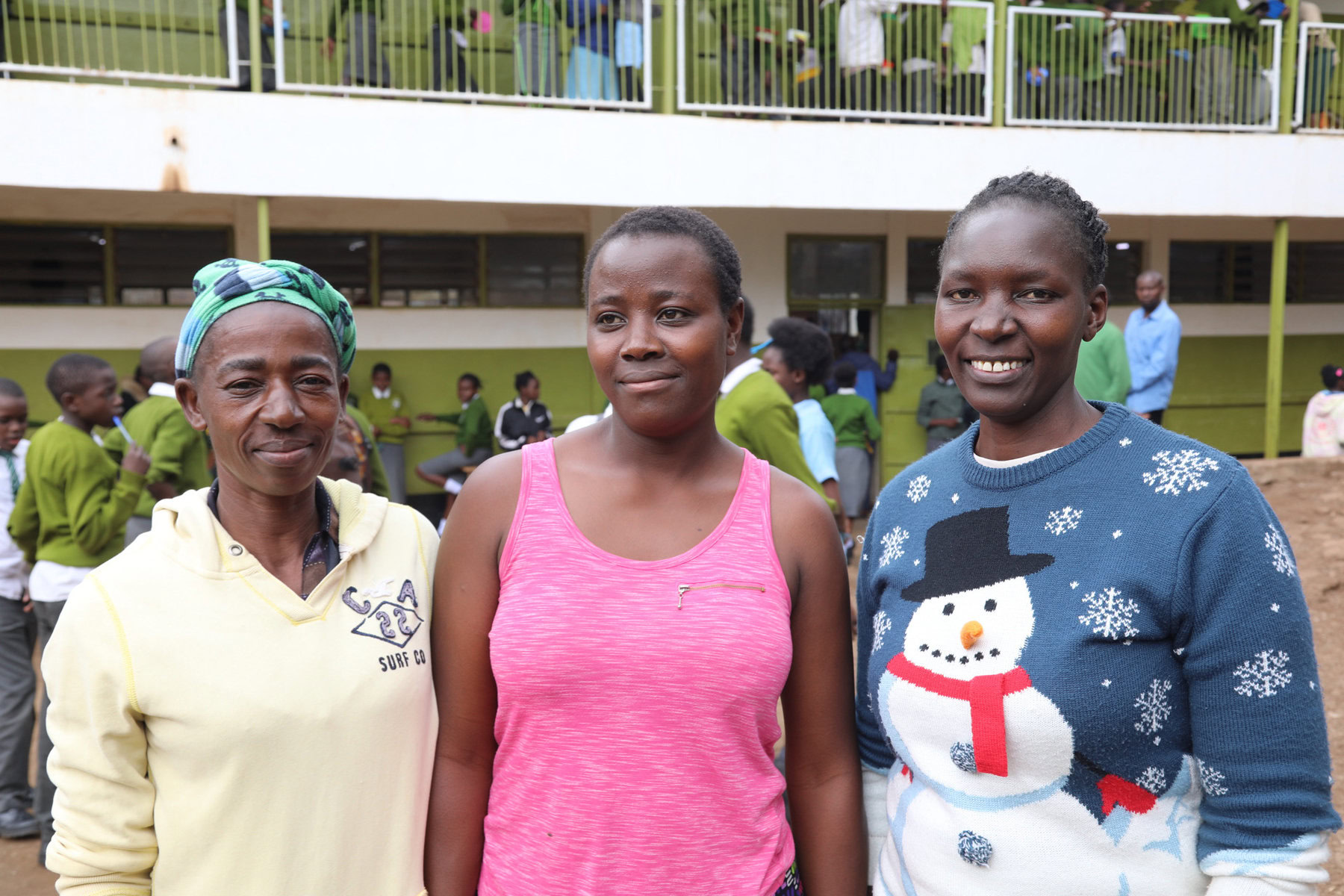 Mothers of students, including Elizabeth Ochau, who are employed to serve food at Olympic Primary School. 