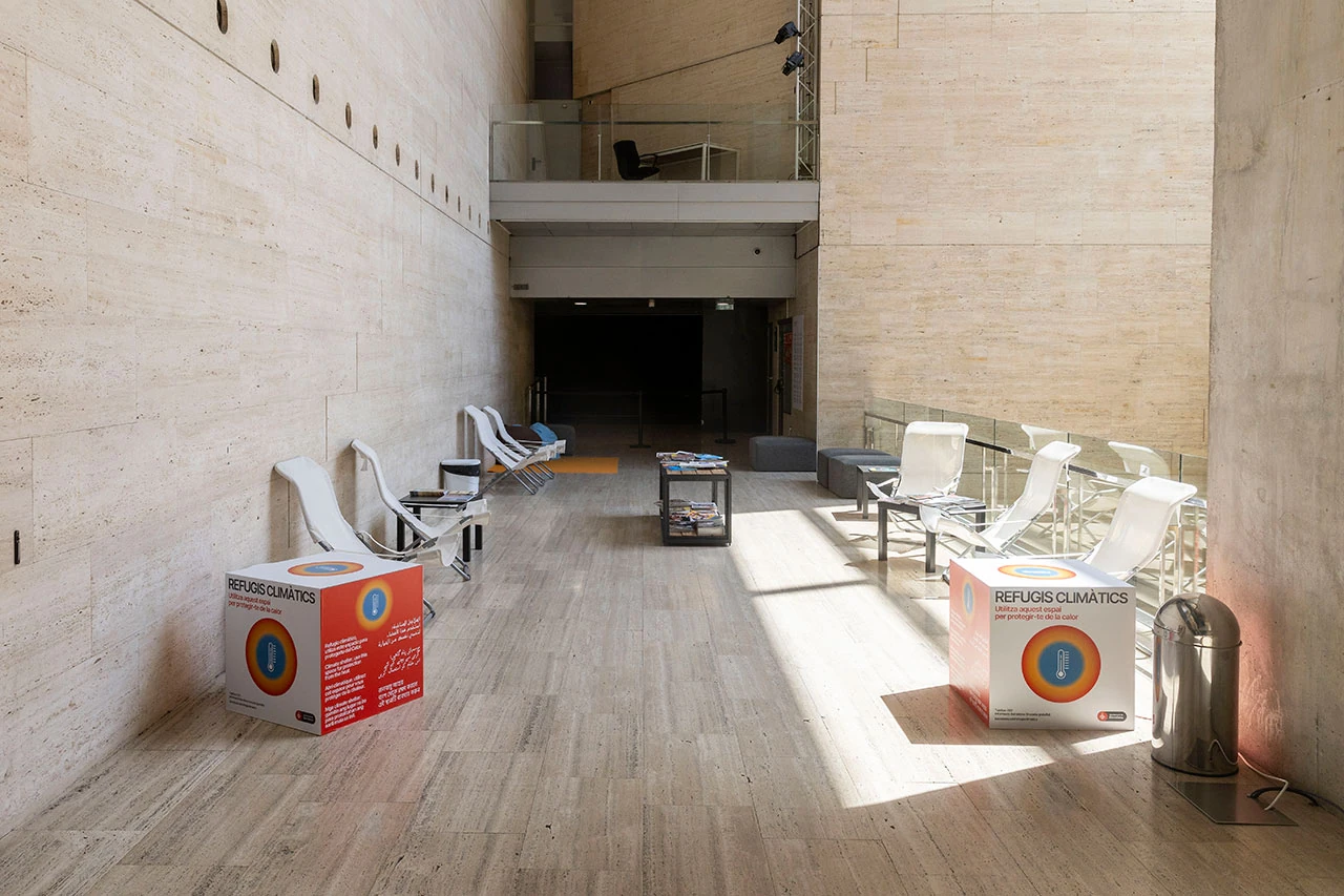 A view of chairs in a well-lit space that is part of a climate shelter.