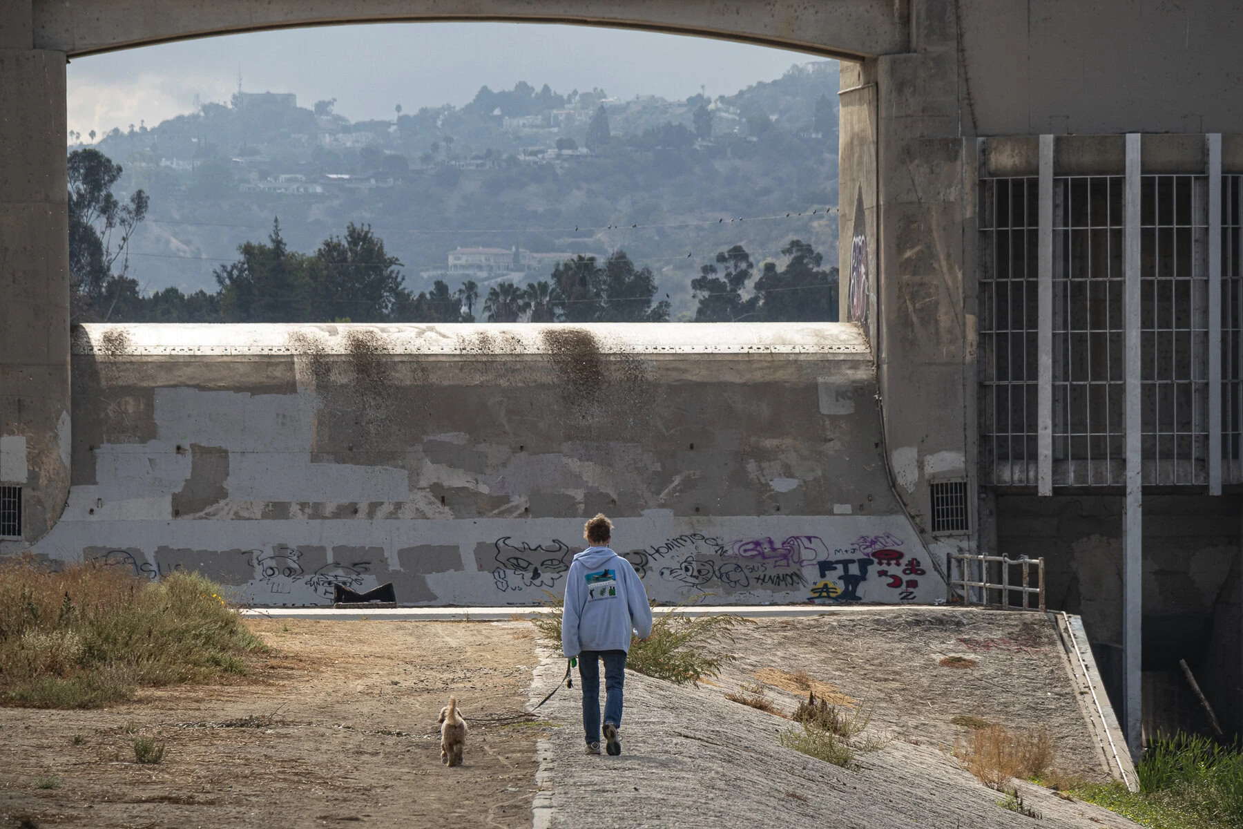 Melanie Winter and her dog Maisie at the Sepulveda Dam.