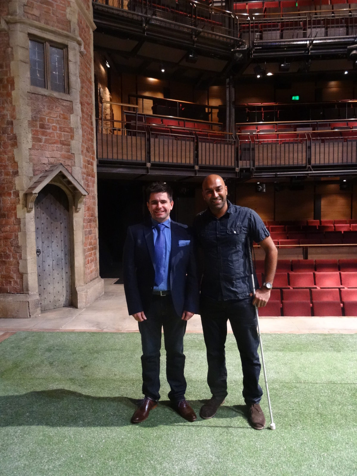 Mark Colman and Amar Latif stand together on a stage.