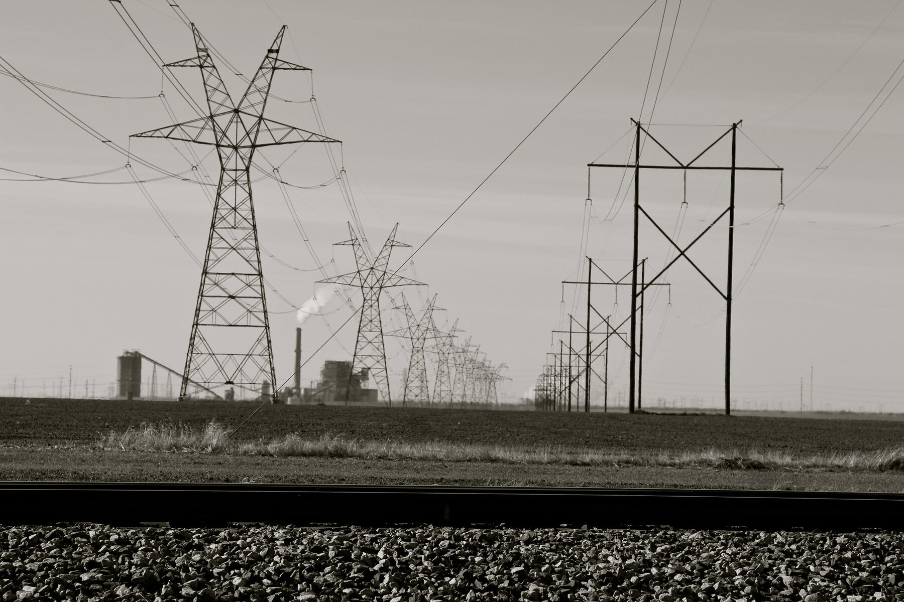 A view of a coal power plant with power lines.