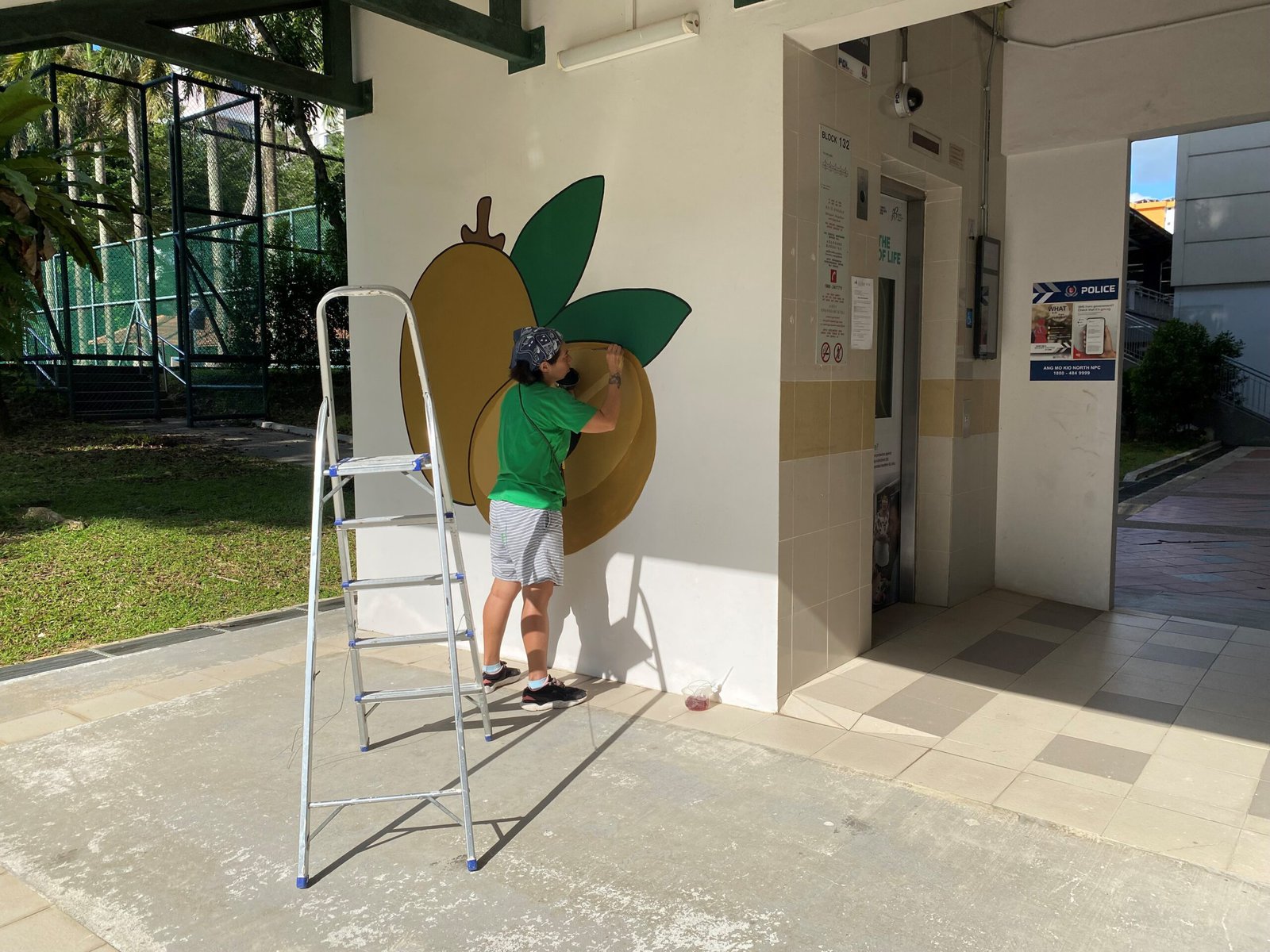 An artist painting a simple mural.