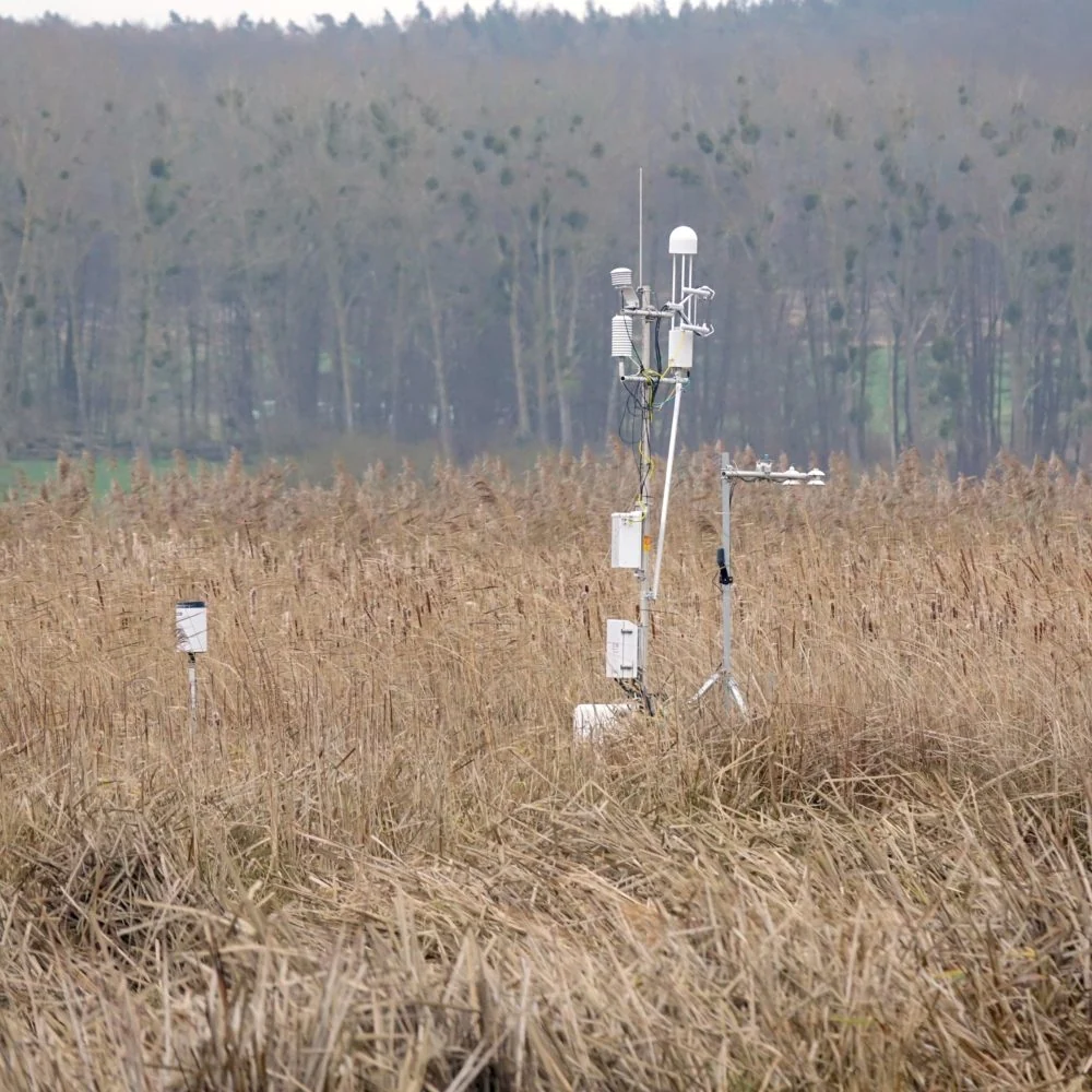 An instrument measures greenhouse gas emissions from his land.