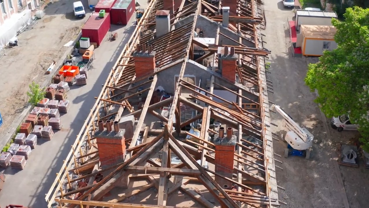 A view from above of a partially deconstructed roof.