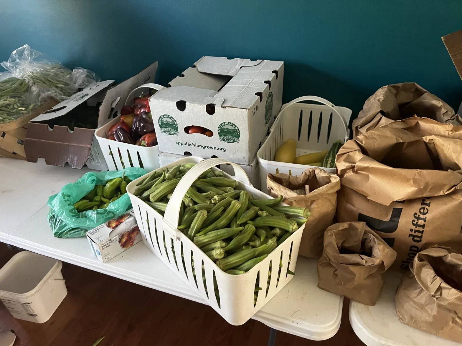 Each week, Sonya Jones and other volunteers with Caja Solidaria pack food boxes for participants — both those through Medicaid, and those not enrolled in the program.