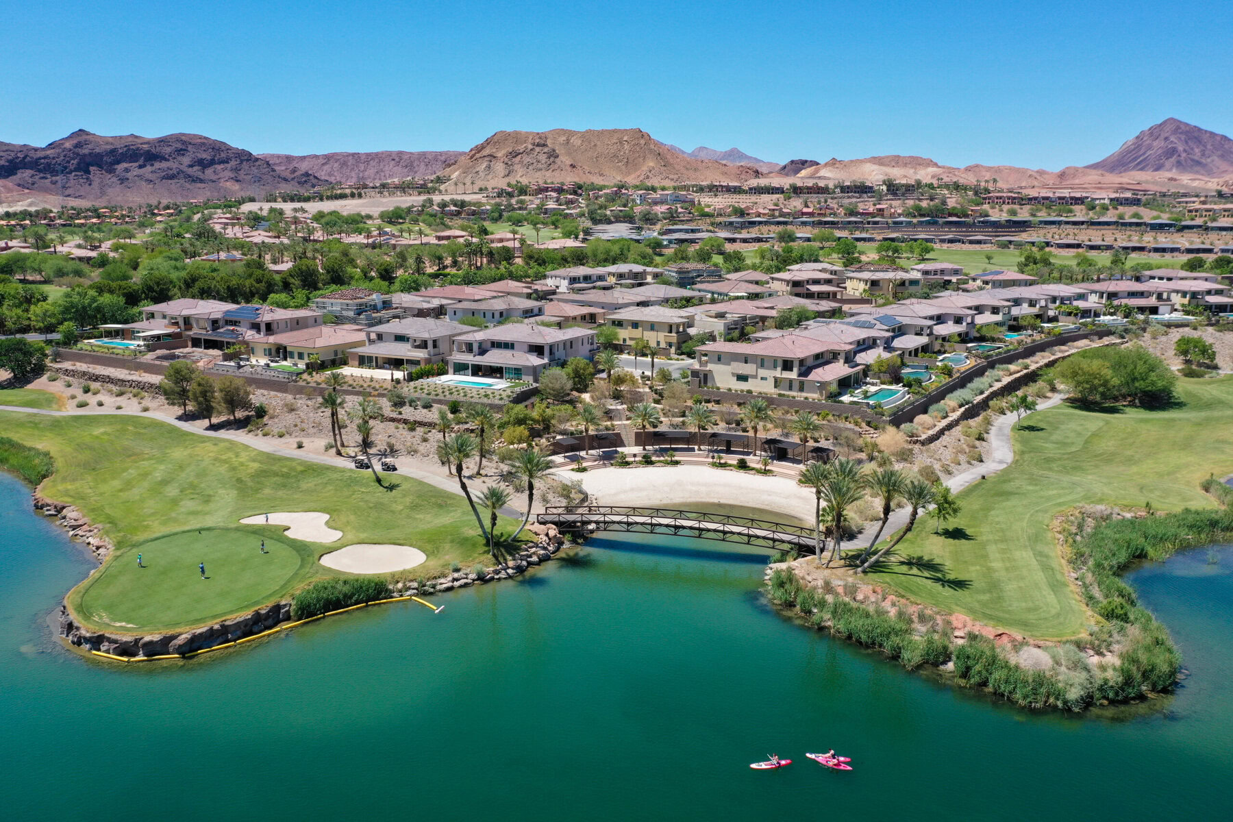 Luxury developments line the edges of Lake Las Vegas, an artificial reservoir created in 1990 on top of the wash that channels water from Las Vegas to Lake Mead. The lake is filled with water that is regularly recycled from Lake Mead.