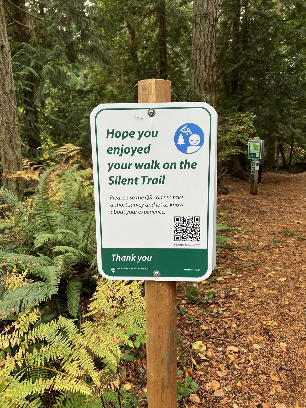 A sign on a Silent Trail invites people to use a QR code to take a survey.